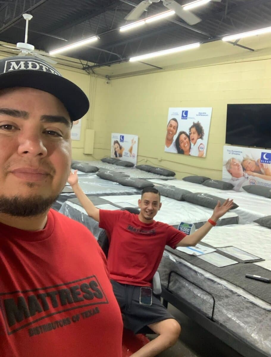 Edward (left) and owner Charlie Sanchez (right) on the showroom floor at Mattress Distributors of Texas